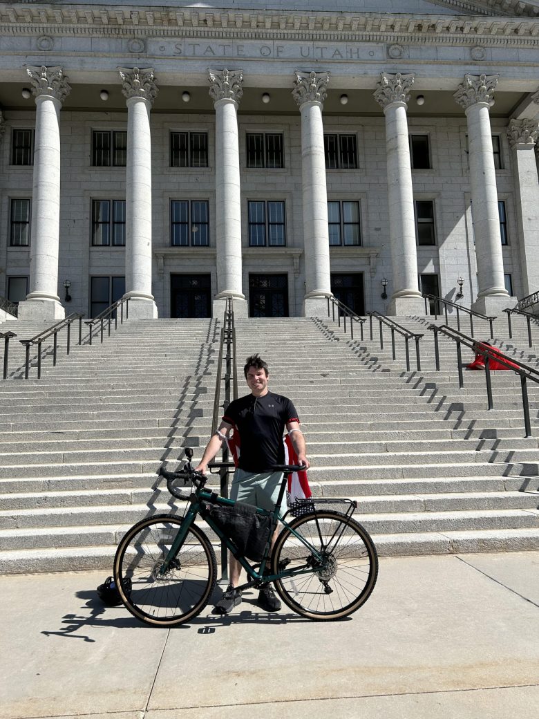 Santa Fe cyclist Teddy Bloom poses for a photo with his bicycle. Bloom is biking across America to raise awareness of and support for four issues he says are vital to the American way of life: freedom of speech, justice, education and unity.